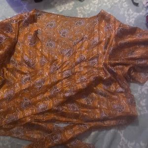 A mesh wrap around tied blouse